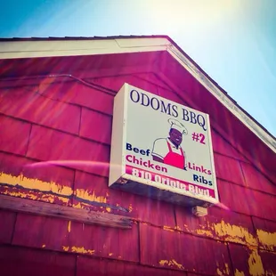 ows a sign on the side of a building