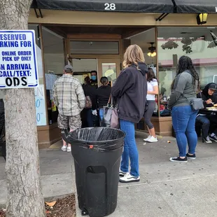 My gurl, waiting for a table.