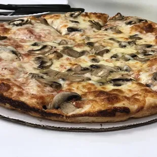 a pizza with mushrooms and cheese