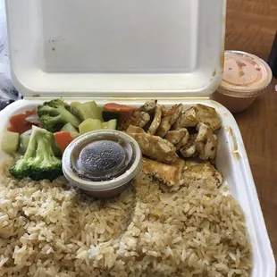 a meal in a styrofoam container