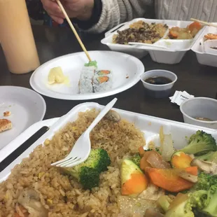 Veggie hibachi and sushi on styrofoam for mom and dad!