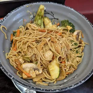 a bowl of noodles and vegetables