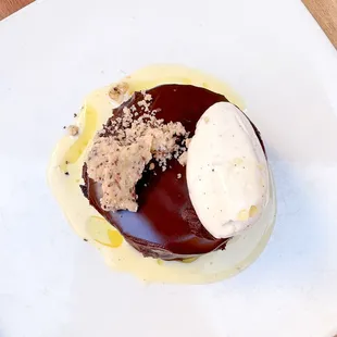 a chocolate dessert with a scoop of ice cream
