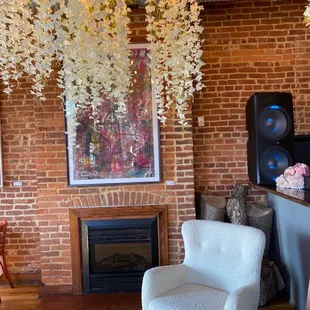 a living room with exposed brick walls