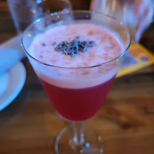 a pink drink in a glass