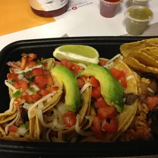3 tacos with chicken, steak and beef brisket