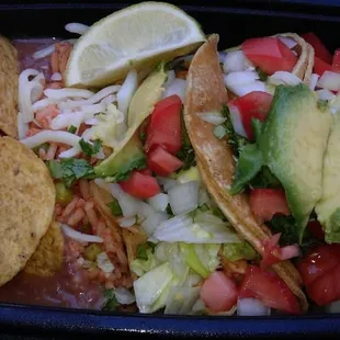 Three tacos, with rice and beans and yumminess