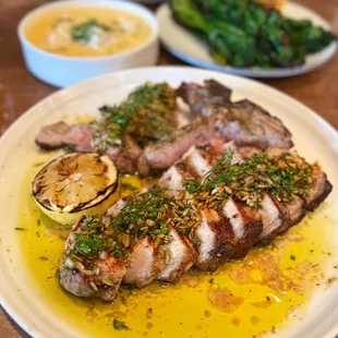 Pork Bistecca Fiorentina w/ fennel seed gremolata, charred lemon | $36 (back: yellowfin tuna, polenta, grilled broccolini)