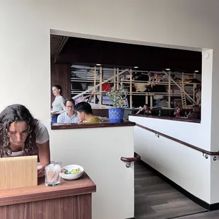 Host station with one dining room in background
