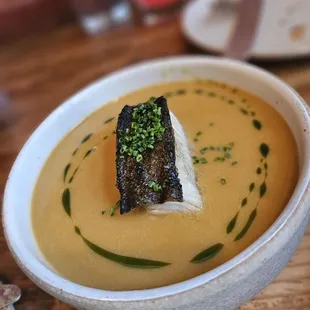 Dungeness crab bisque, and black cod with herb oil