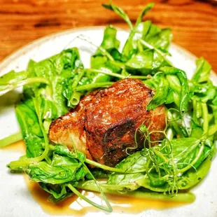 Pork belly, pea vines and turnips green in a anchovy sauce