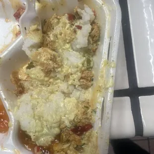 This is supposed to be rice. It came underneath the baked fish I ordered that was very salty. Looks like porridge.