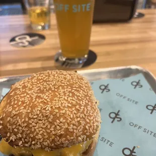 Burger with juicy melted cheese and a cold beer