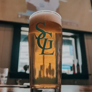 a glass of beer on a table