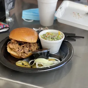 Pulled pork sandwich with bacon, coleslaw &amp; bbq sauce