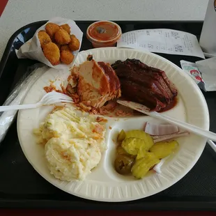 Delicious Texas Double with smoked brisket, pork loin, tater salad and okra! Broke da mout&apos;!