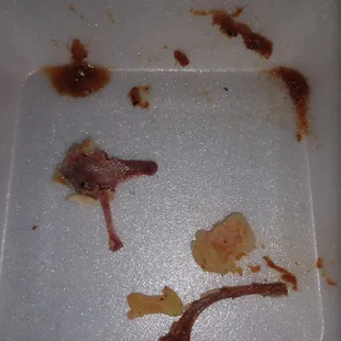 Bones and gristle I pulled from my first four bites of their smoked chicken sandwich