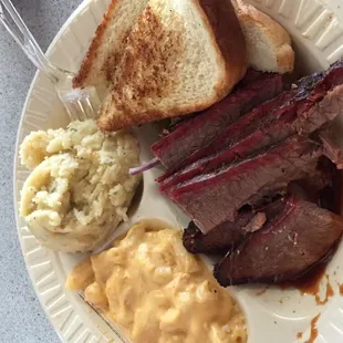 Sliced beef, Mac and cheese, potato salad, and slice of bread