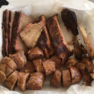 Ribs, brisket, Sausage and baked potato.