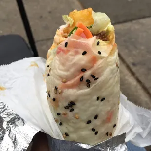  a burrito wrapped in foil