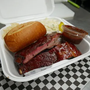 BBQ Pork Rib Plate. Includes Three Ribs. Dinner Roll &amp; Choice Of Sides.
