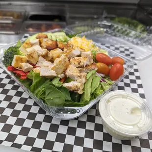 OTG Grilled Chicken Salad, Mixed Greens And A Side Of Dressing.