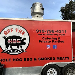 a bbq truck parked in a parking lot