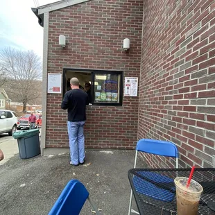 a man ordering a drink