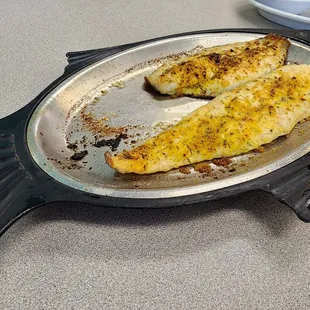 Broiled trout and broiled flounder on a cute platter