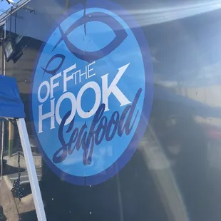 the logo on the side of a food truck
