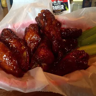 House smoked BBQ wings. One of their 13 flavors!! Yummy!!