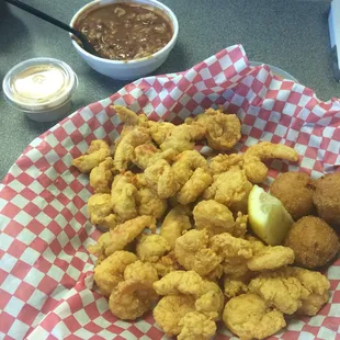 Half shrimp/half crawfish basket with a side of beans.