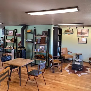 people sitting at tables in a coffee shop