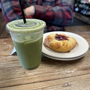 Matcha latte with a dash of agave and a raspberry danish.