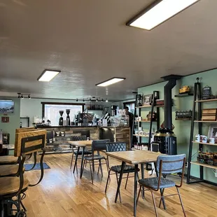 a coffee shop with tables and chairs