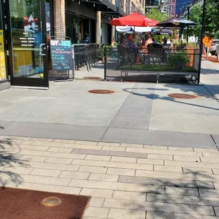 an empty sidewalk in a city