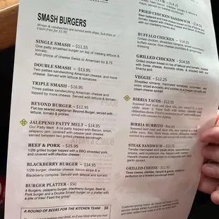 a person holding a menu