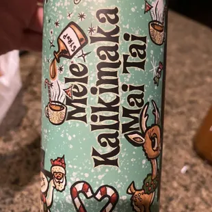 a hand holding a can