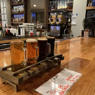 Flight of beer on train track stand