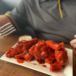 a plate of chicken wings