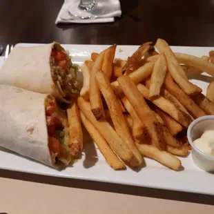 a plate of fries and a burrito