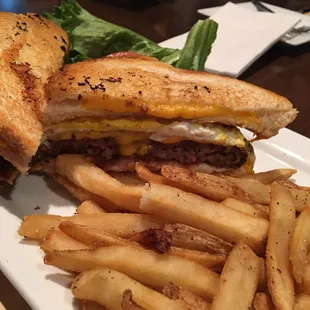 The Belly Buster. It has a burger, two fried eggs, three prices of cheese- with grilled cheese sandwiches for buns. Amazing!