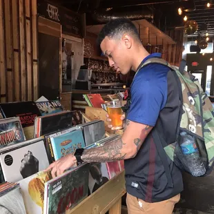 a man looking at records