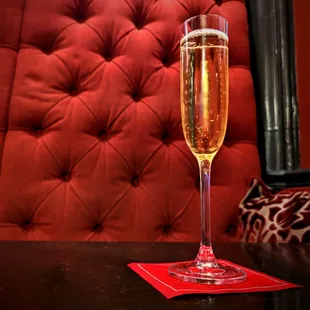 a glass of champagne on a table