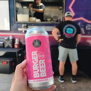 a person holding a can