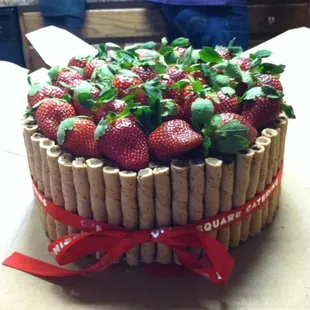 Delicious chocolate cake with strawberries on top! Love Off the Square Catering!