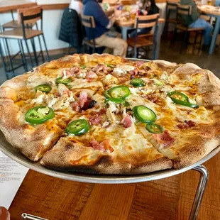 a pizza on a serving tray