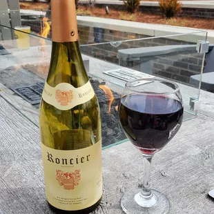 a bottle of wine and a glass of wine