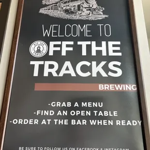 Sign to the right when you walk in