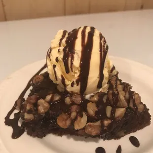 Warm Brownie pecan pie  served with ice cream